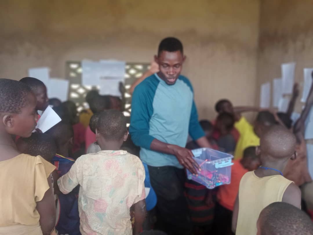 Children and volunteers at Inzozi Learning Center — moment 9